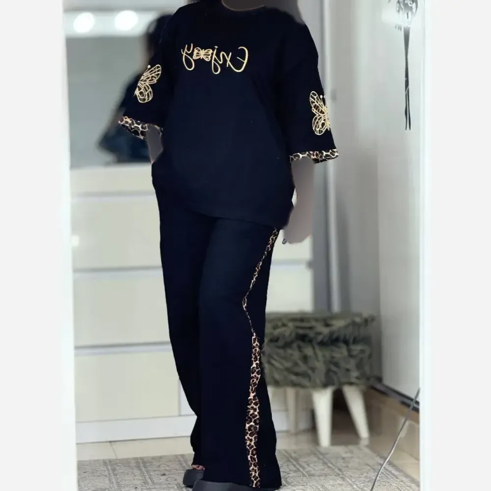 ست تی شرت و شلوار زنانه طرح enjoy جنس اسپان گلکسی رنگ مشکی سایز فری 38 تا 46