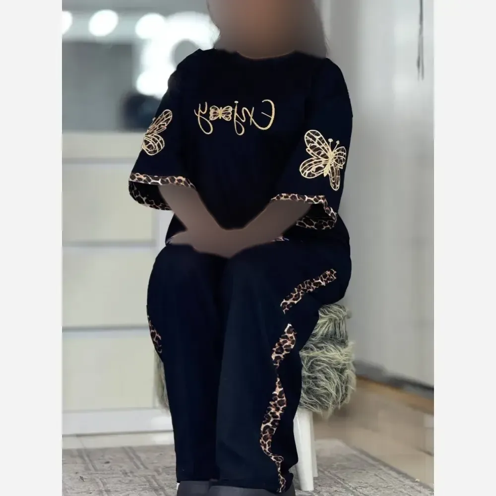 ست تی شرت و شلوار زنانه طرح enjoy جنس اسپان گلکسی رنگ مشکی سایز فری 38 تا 46